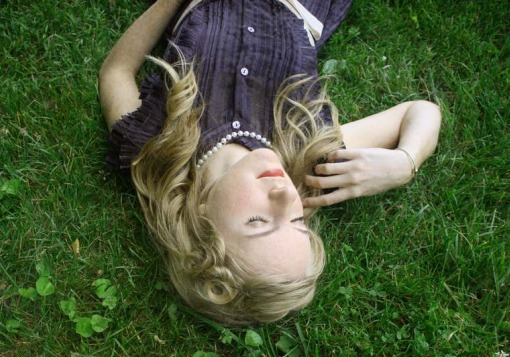 Girl lying on grass