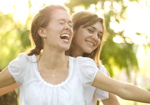 Two girls laughing.