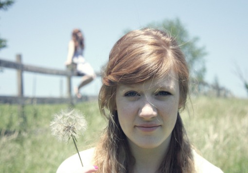 Girl in field with her sister