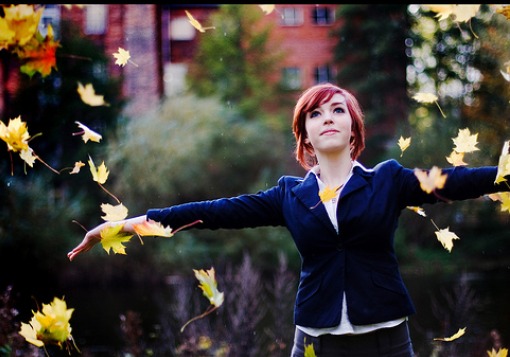 Girl Throwing Leaves