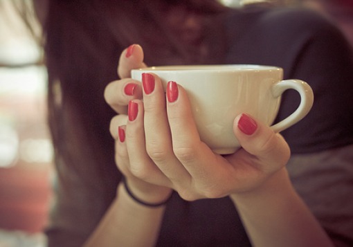 Girl holding coffee cup | Girl Defined