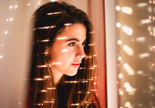 Girl looking out window. girl defined