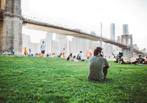 Guy Sitting In Field