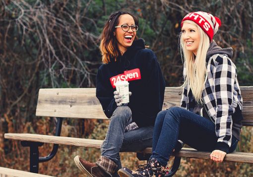 Two Girls Laughing on a bench