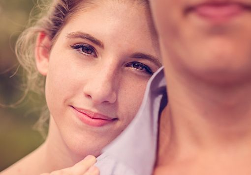 Girl Smiling over shoulder