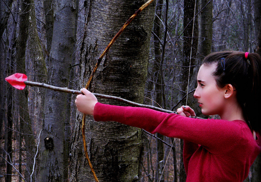 Girl shooting arrow