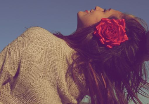 Girl smiling with flower