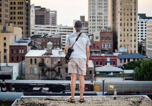 guy looking out over city