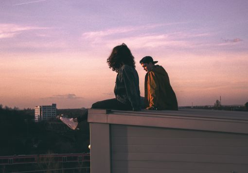 girl and guy sitting