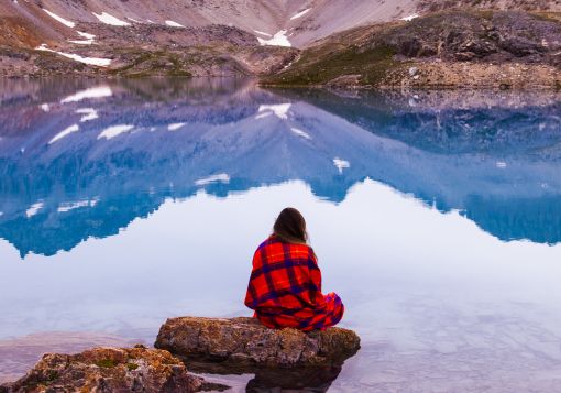 girl sitting on a rock